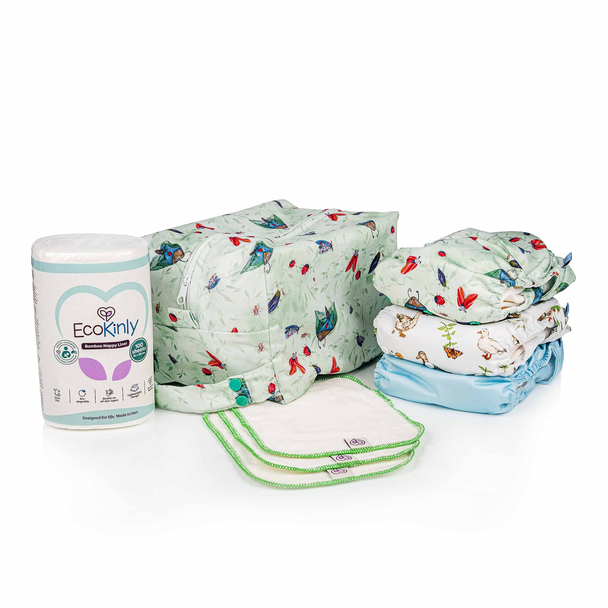 Eco-friendly nappy starter kit including diapers and a container on a white background