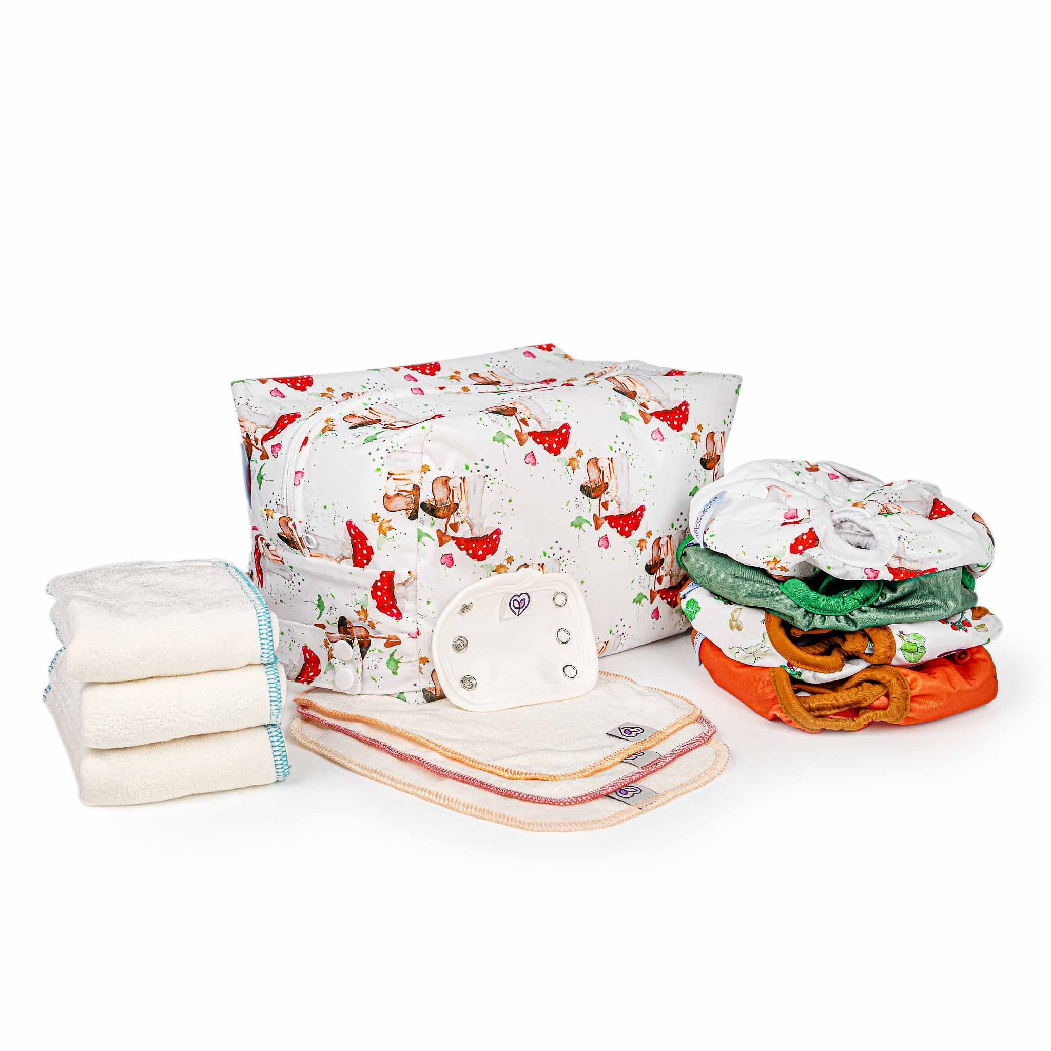 Stack of reusable baby cloth diapers with a patterned bag on a white background