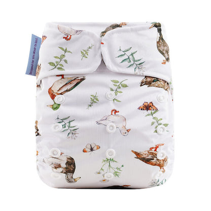 Patterned diaper cover with ducks and plants on a white background