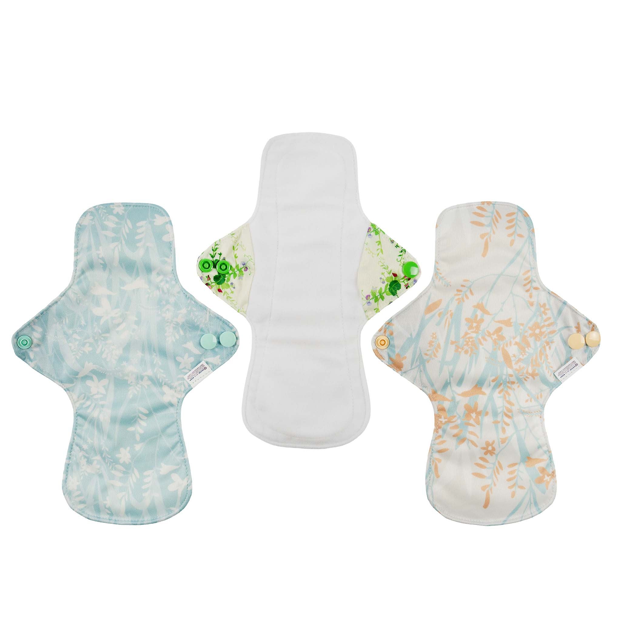 Three reusable menstrual pads with floral patterns on a white background