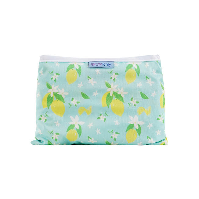 Reusable baby changing mat with lemon pattern on a light blue background