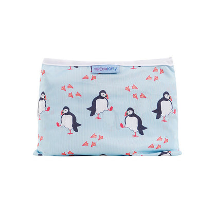 Reusable baby changing mat with penguin design on a light blue background